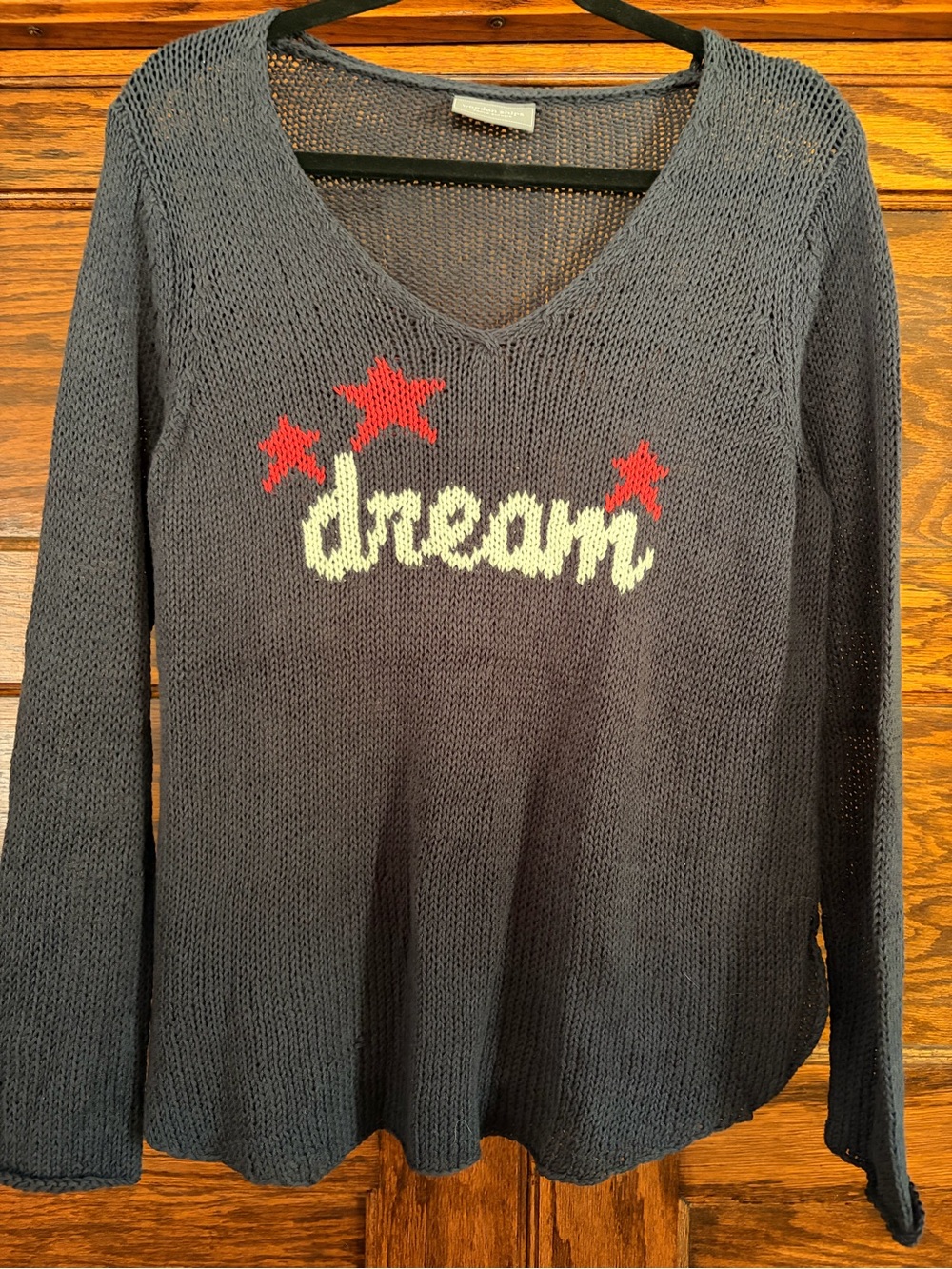 Wooden Ships Black V-Neck Knit Sweater with Cream 'dream' and Red Stars